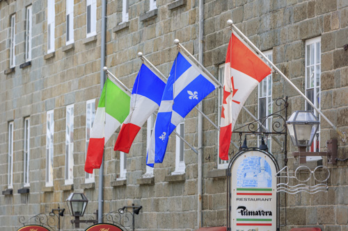 The Italian, French, Quebecois, and Canadian flags in Quebec City