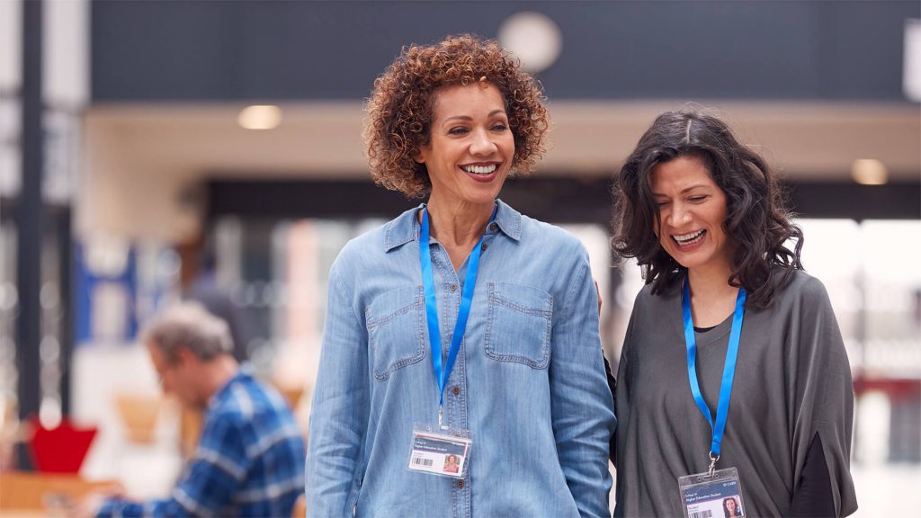 Two teachers walking together in school