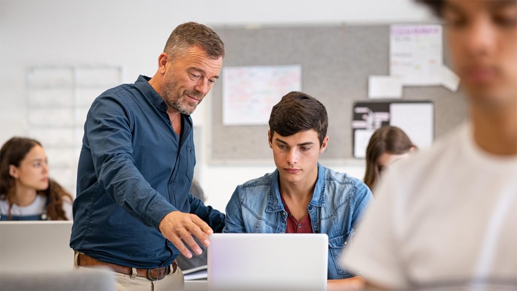 Teacher and student in computer lab