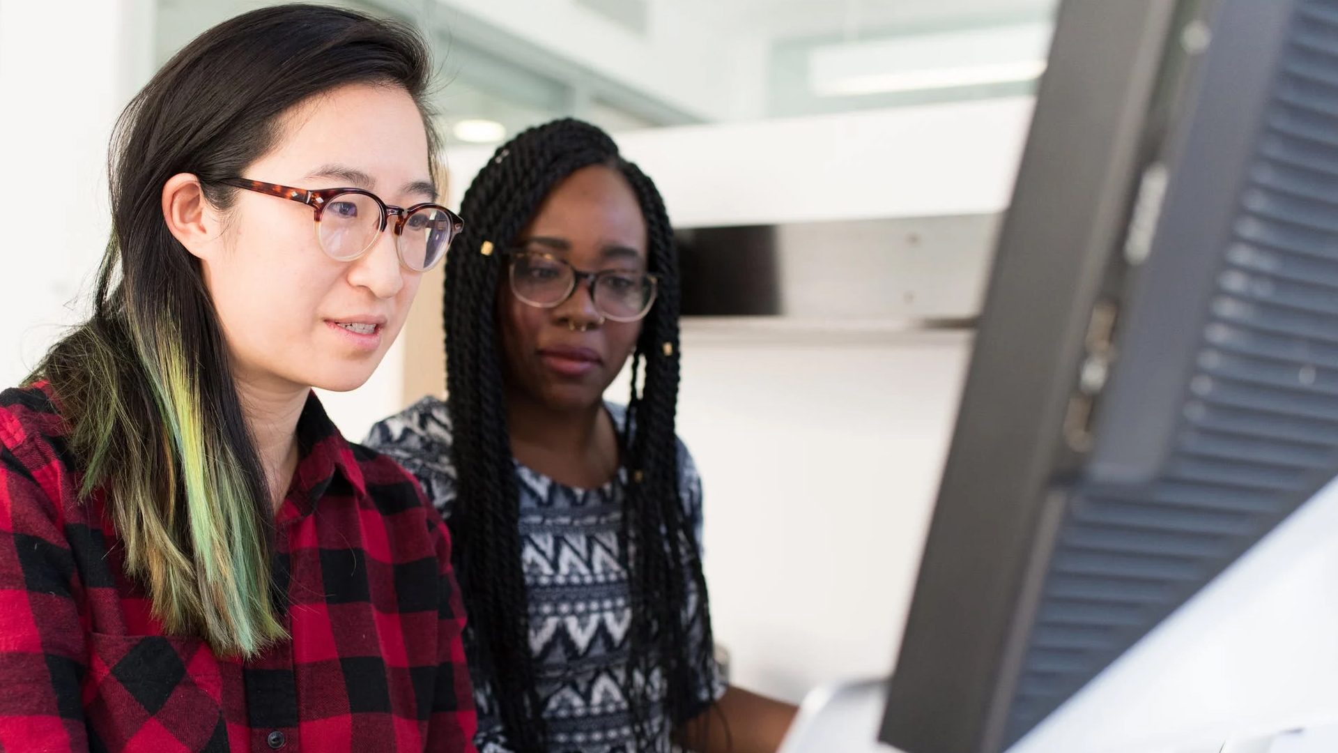 Two teachers working at a computer