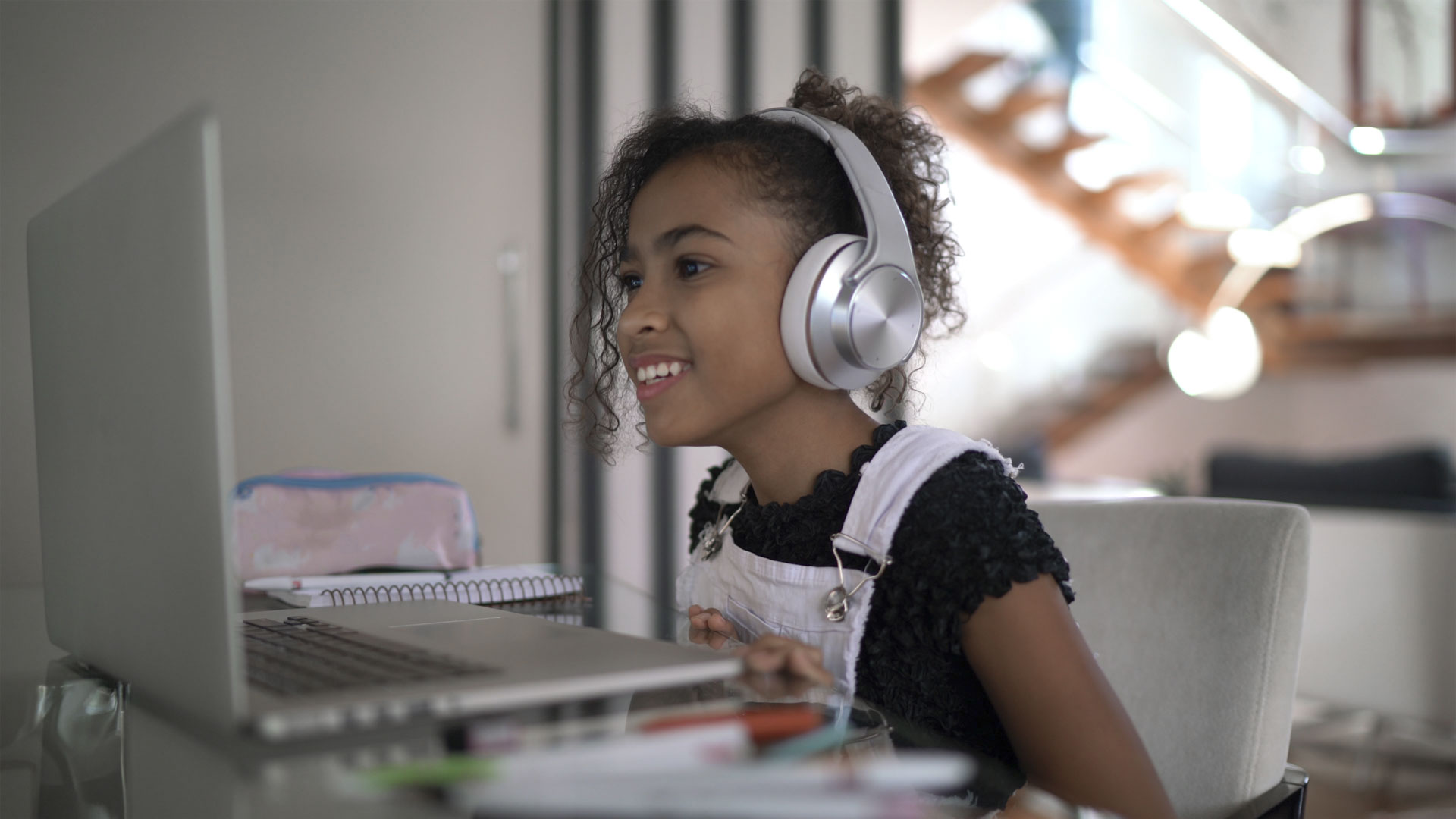 Girl studying on a video call at home