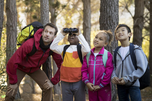 teacher and students exploring