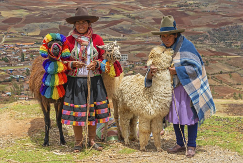 Quechua women wearing traditional bright clothing